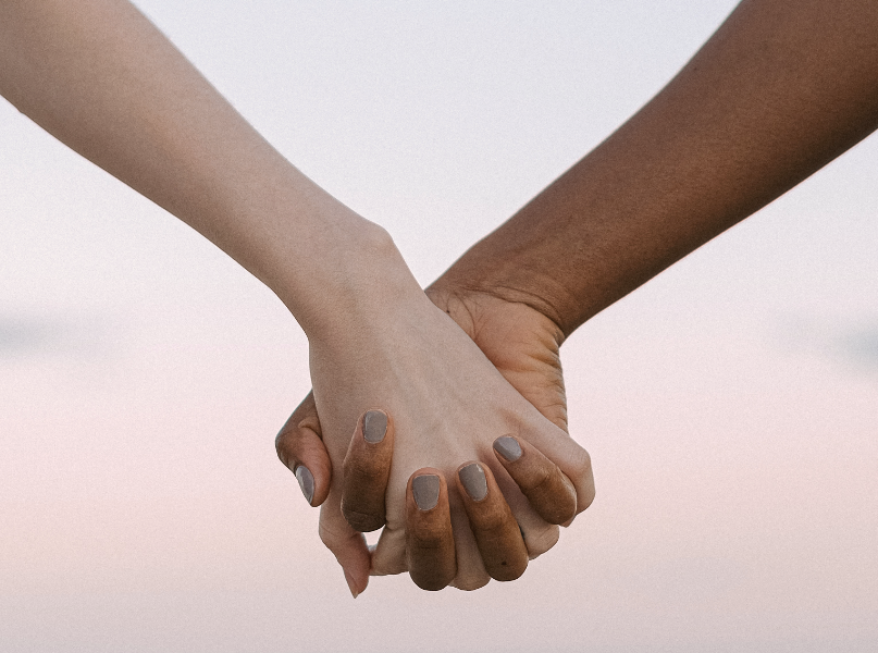 Person holding up another persons hand